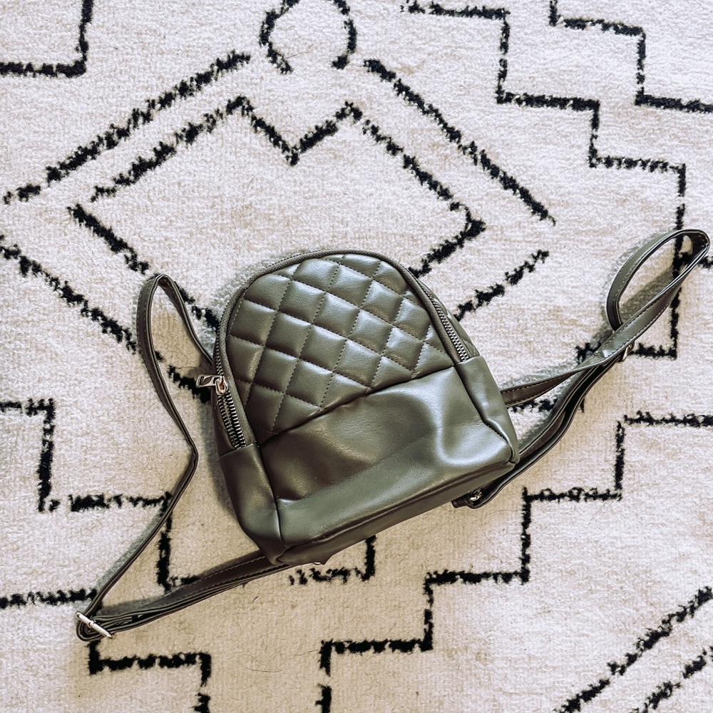 Mini green quilted backpack